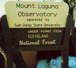 photo of a sign saying
`Mount Laguna Observatory operated by San Diego State University
under permit from Cleveland National Forest'